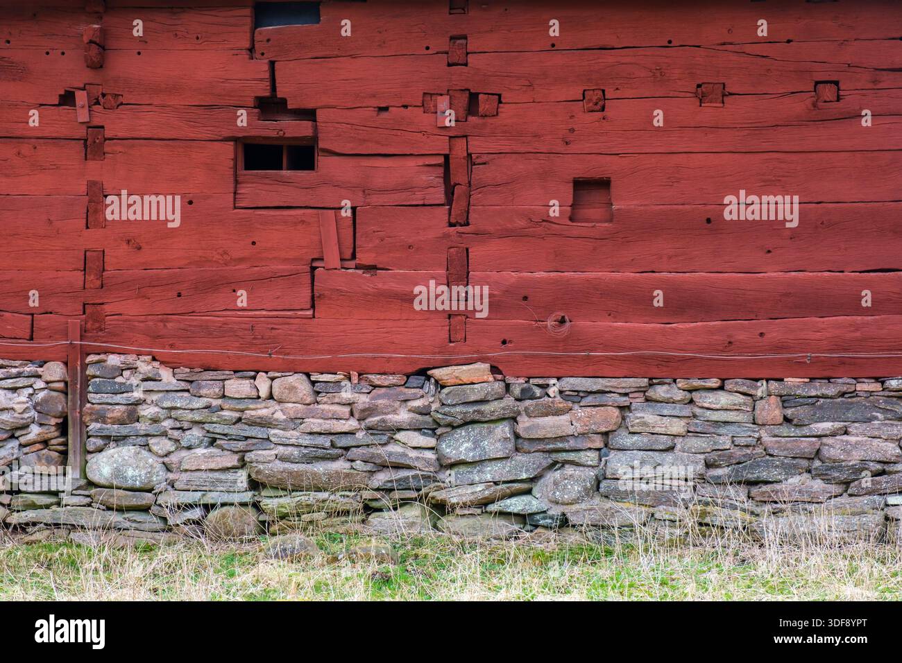 Red timbered old house with stones Stock Photo