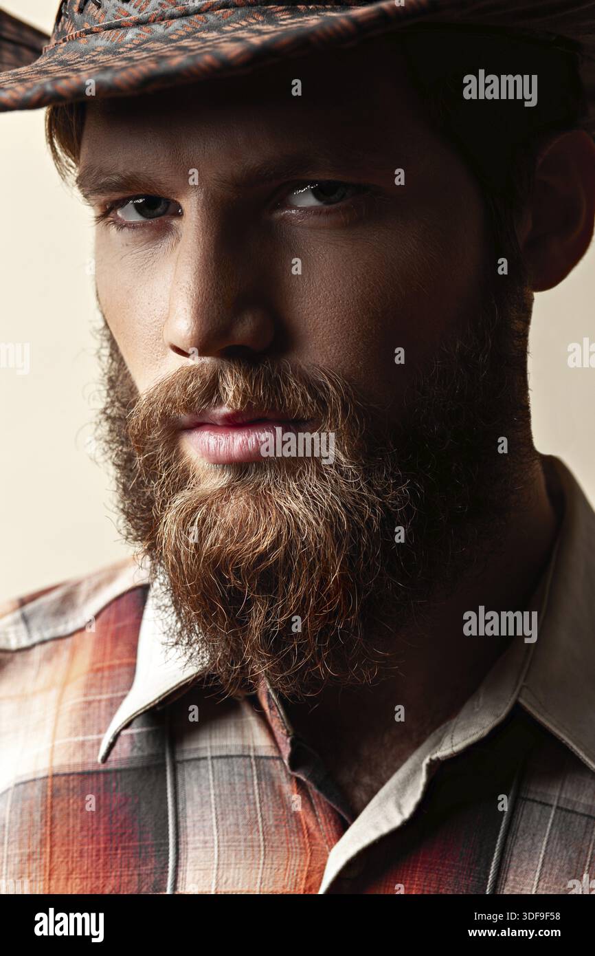 Young handsome man in a cowboy hat Stock Photo