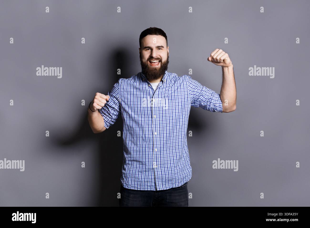 Excited bearded man very glad to success Stock Photo