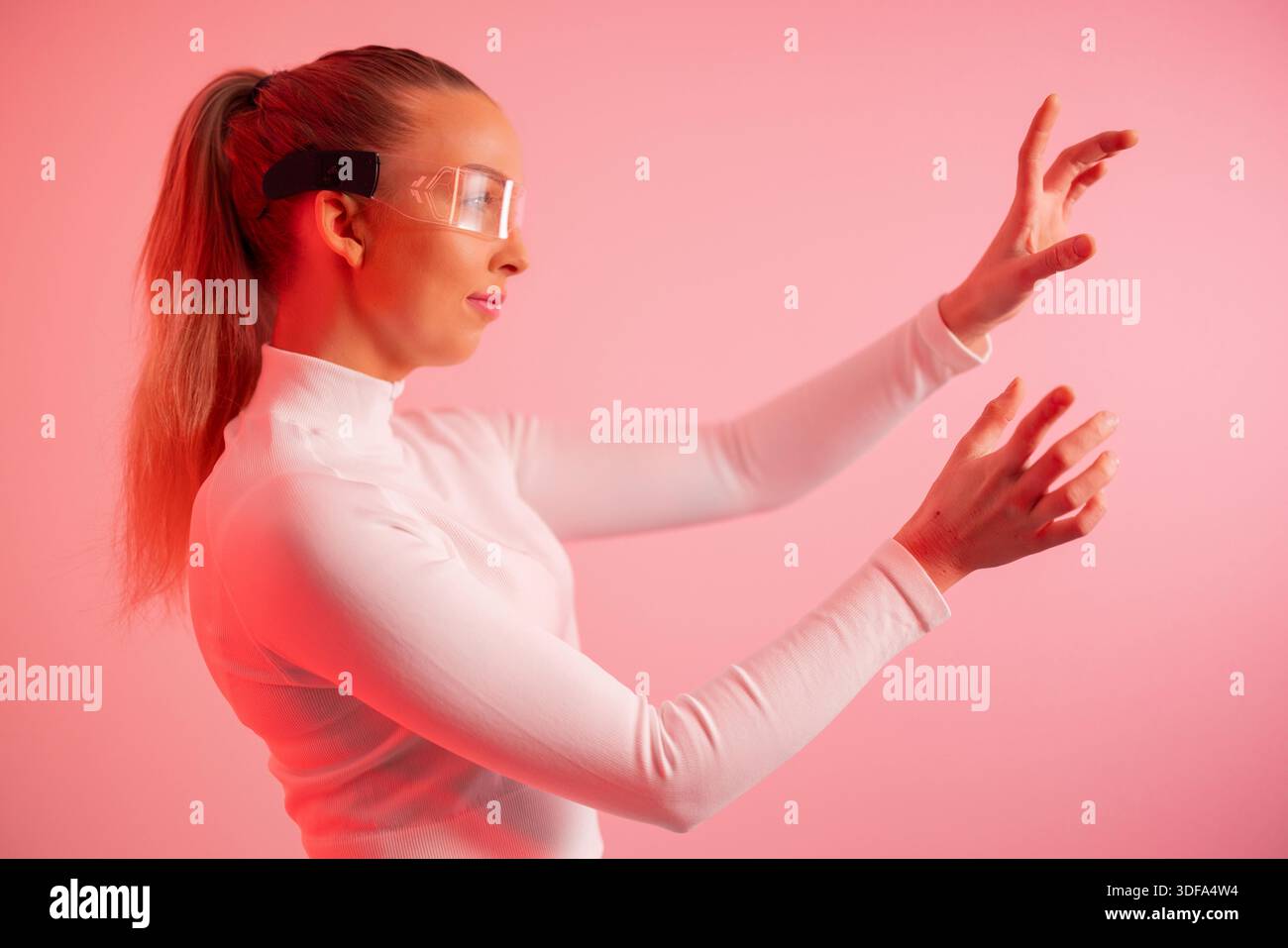 Young woman using futuristic technology Stock Photo