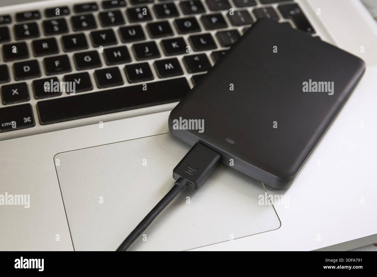 External Hard Disk Over Laptop Keyboard Stock Photo