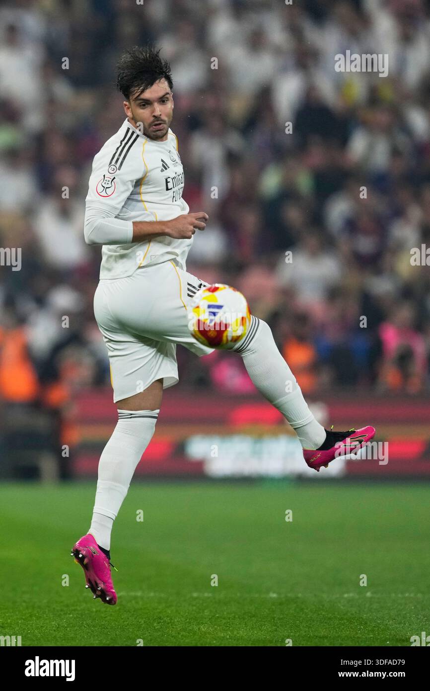 Real Madrid's Raul Asencio jumps for the ball during the Spanish Super ...