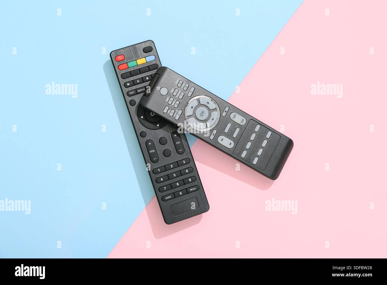 Different modern TV remote controls on color background Stock Photo