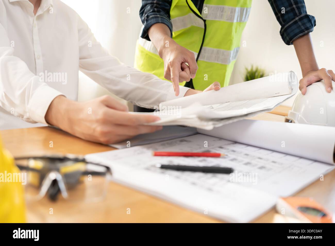 Check Up Engineering Engineers team and owner discuss check and review the blueprint of ...