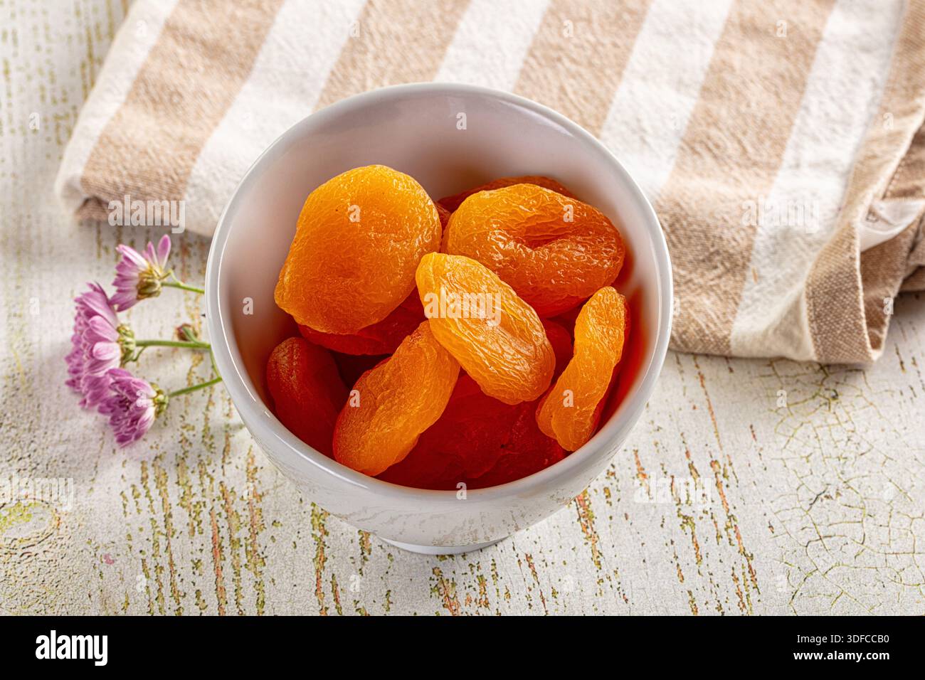 Sweet dry aprocot fruit heap in the bowl Stock Photo - Alamy