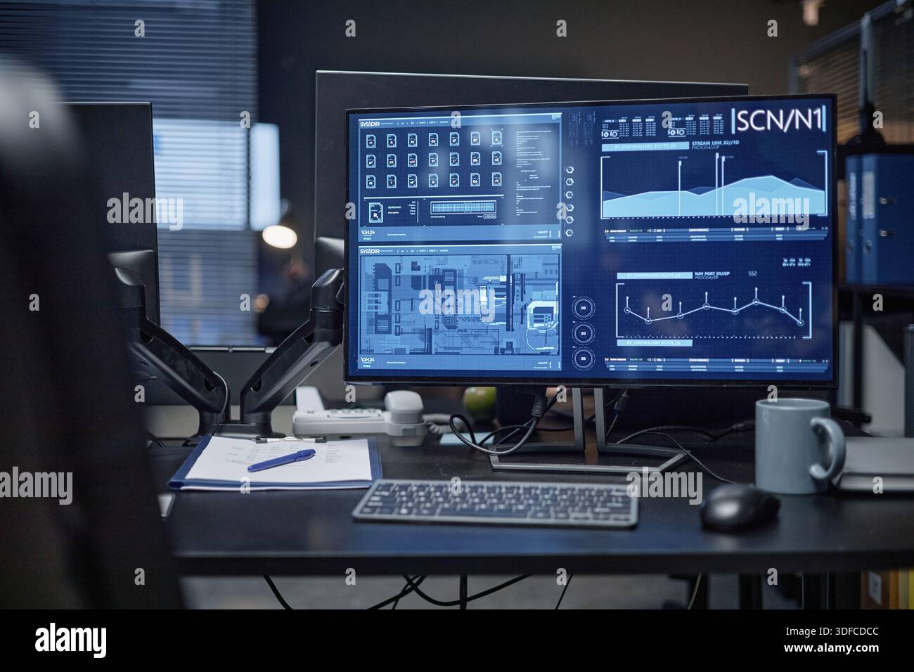 Modern Office Desk Featuring Computer Displaying Security System Interface Stock Photo
