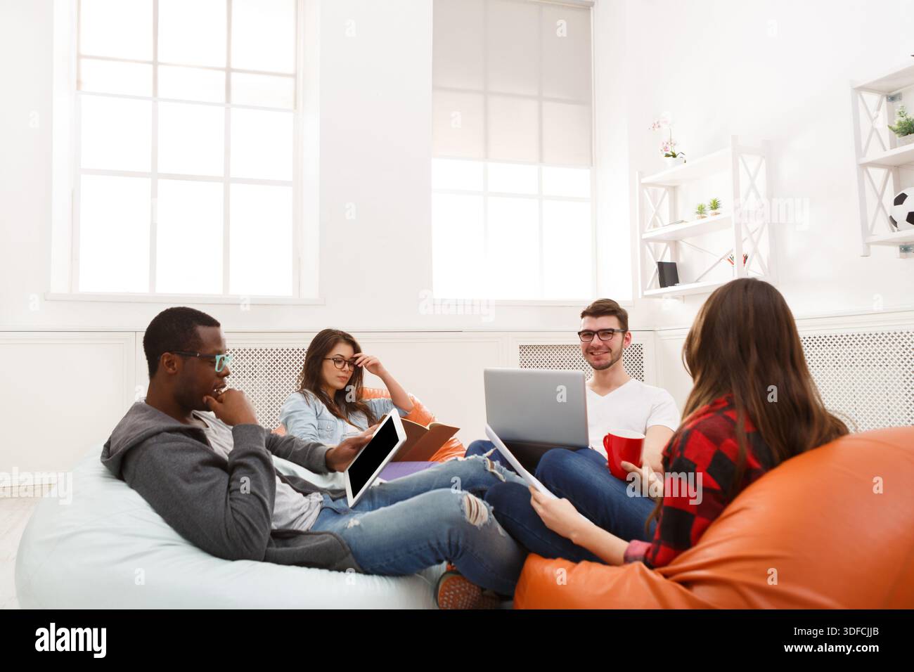 Creative professional designers discussing ideas Stock Photo