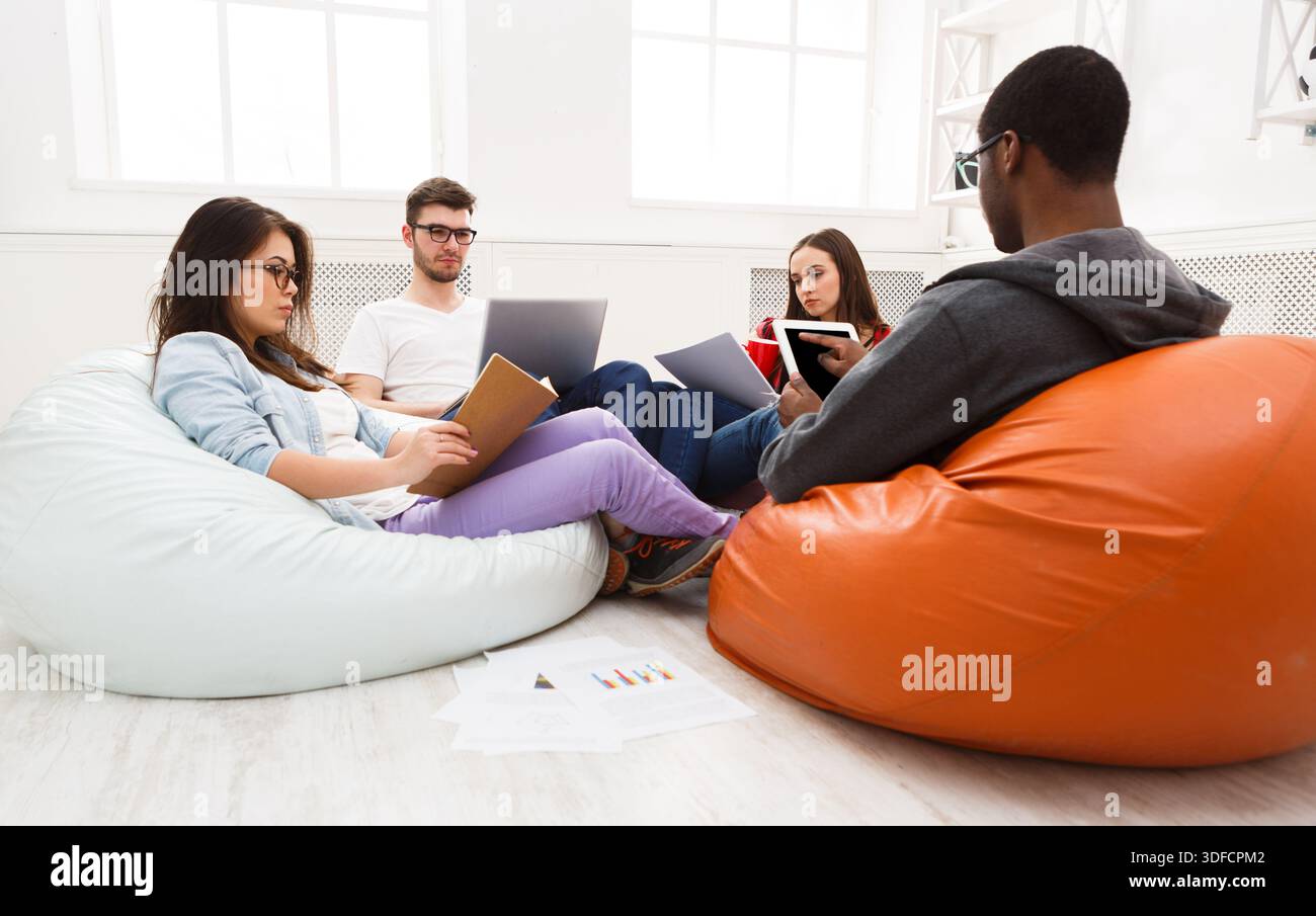 Students share opinions during break Stock Photo