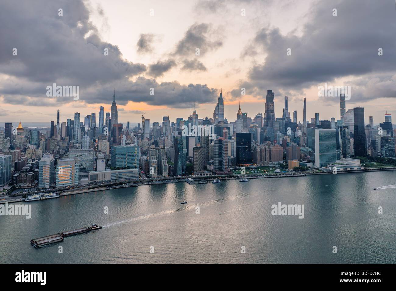 Aerial view of a vast cityscape with towering skyscrapers including the ...