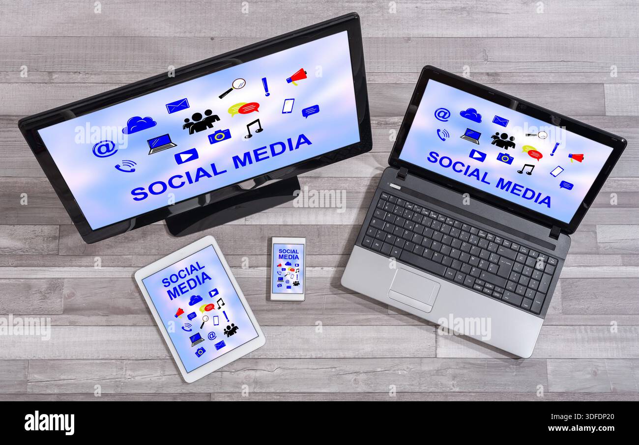 Social media concept shown on different information technology devices Stock Photo