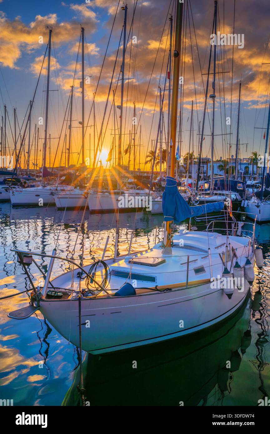 A lovely sunset sparkles across Puerto de Mogan Marina during a lovely warm day in Gran Canaria. 27th December 2025. Stock Photo
