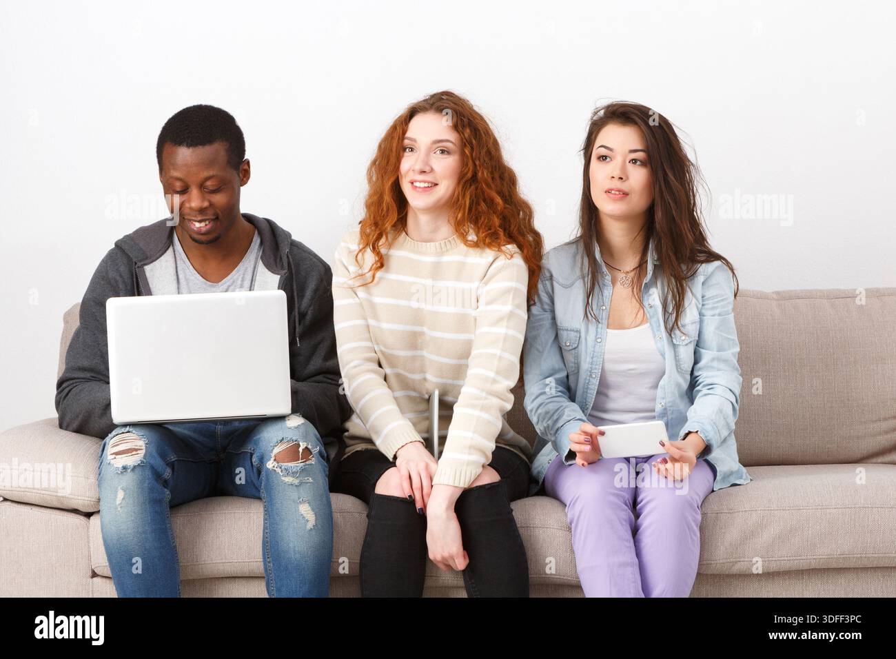 Young people using gadgets, students, technology Stock Photo