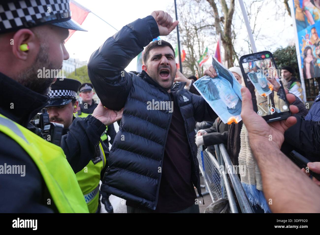 People protest outside the Iranian embassy, in London. Hundreds of ...