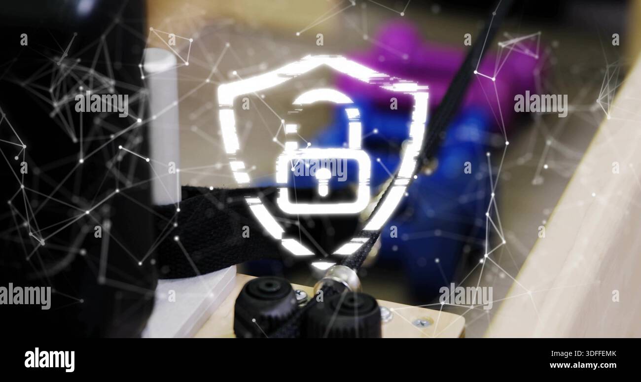 Displaying glowing shield with padlock overlay on workbench, showing network mesh and knobs Stock Photo