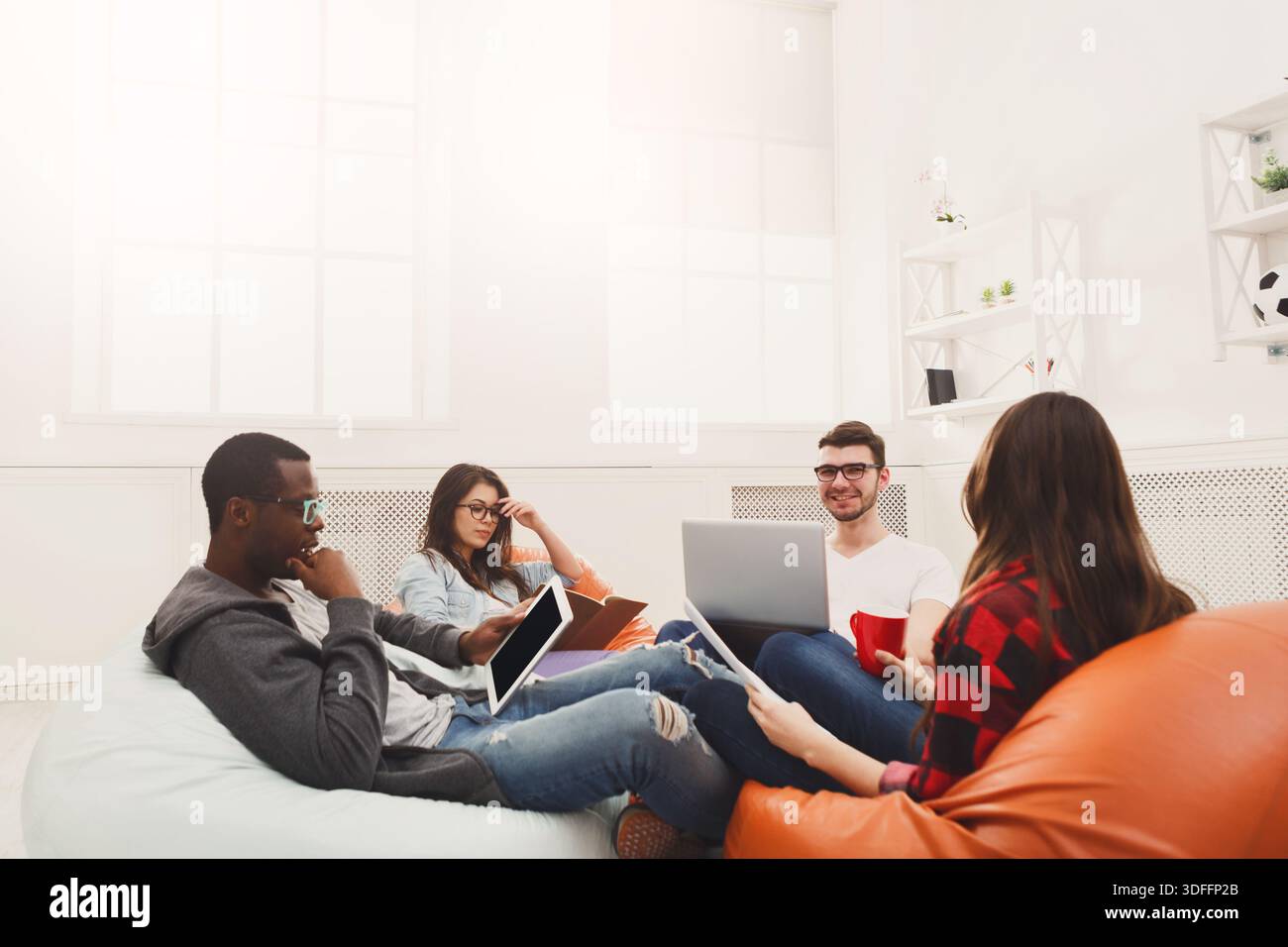 Students share opinions during break Stock Photo