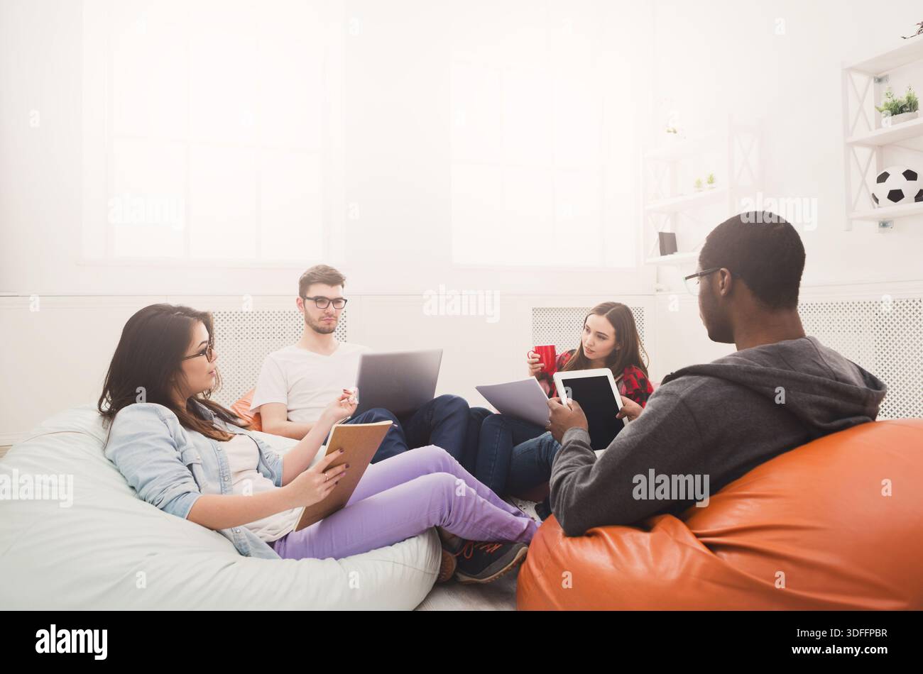 Students share opinions during break Stock Photo