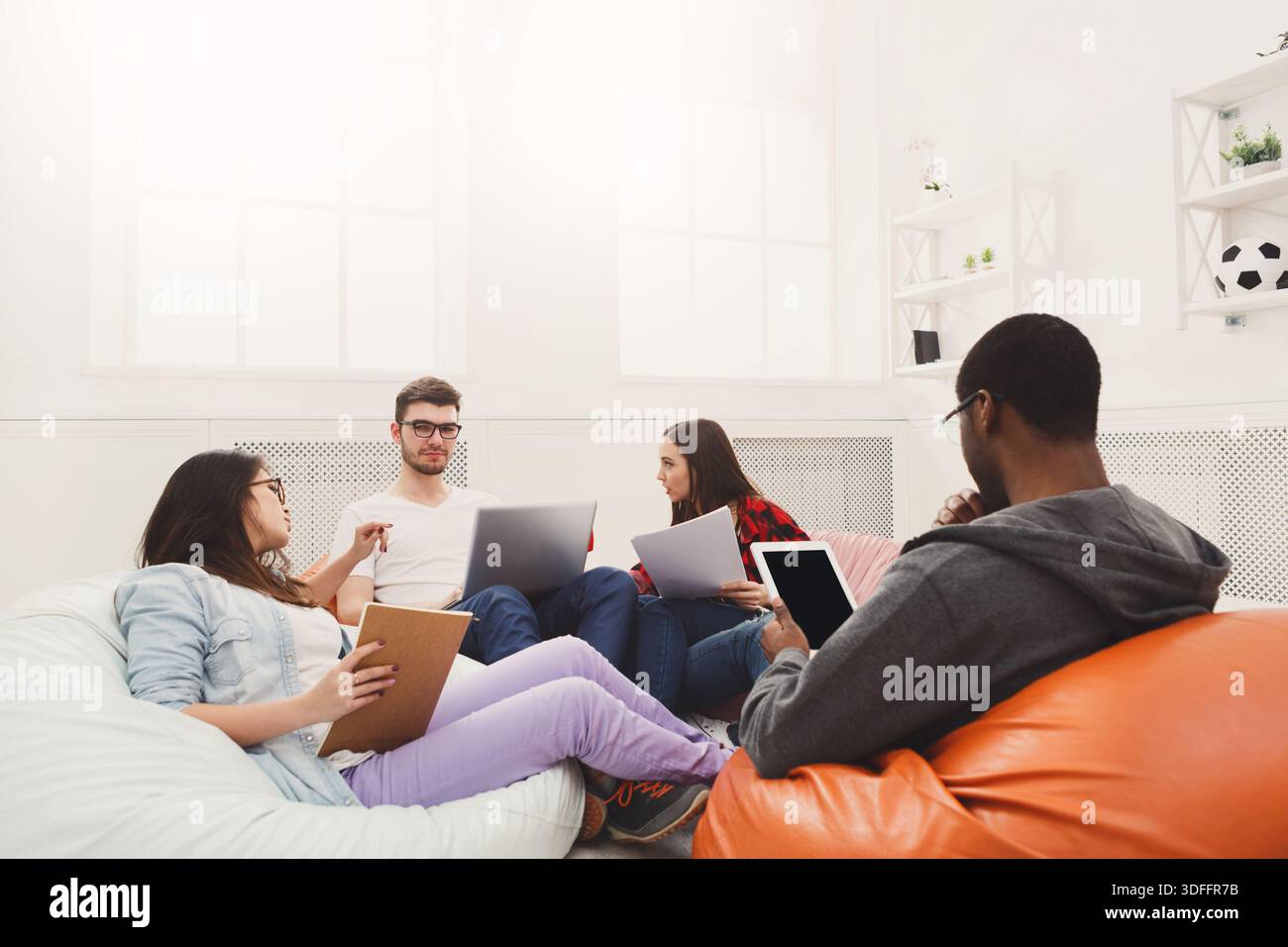 Students share opinions during break Stock Photo