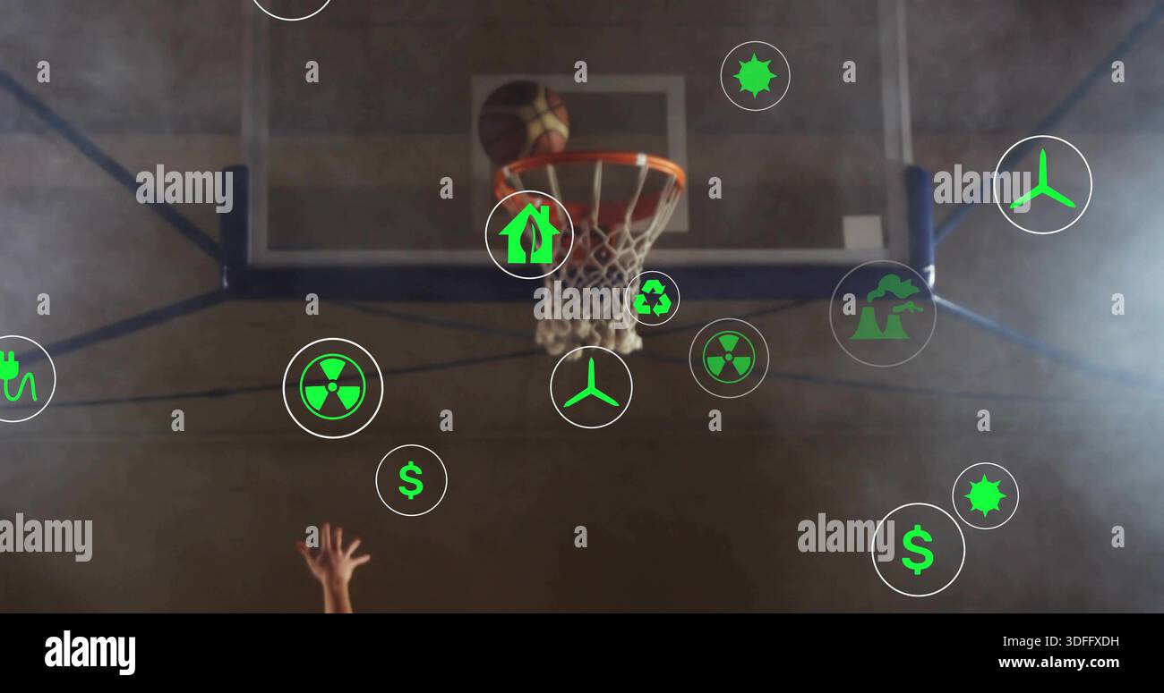 Reaching hand grabbing ball at rim on center hoop in gymnasium, jersey ...