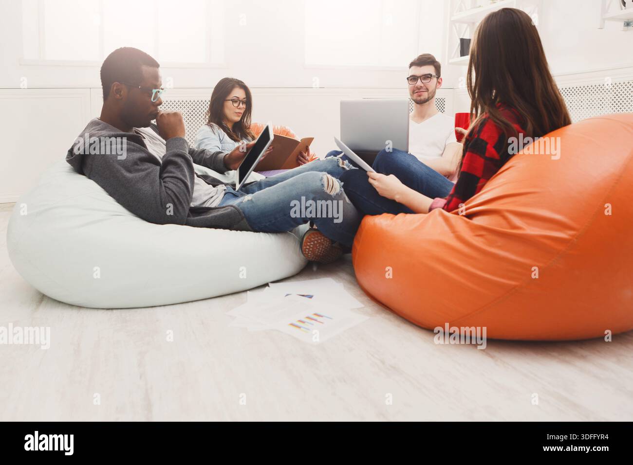 Students share opinions during break Stock Photo