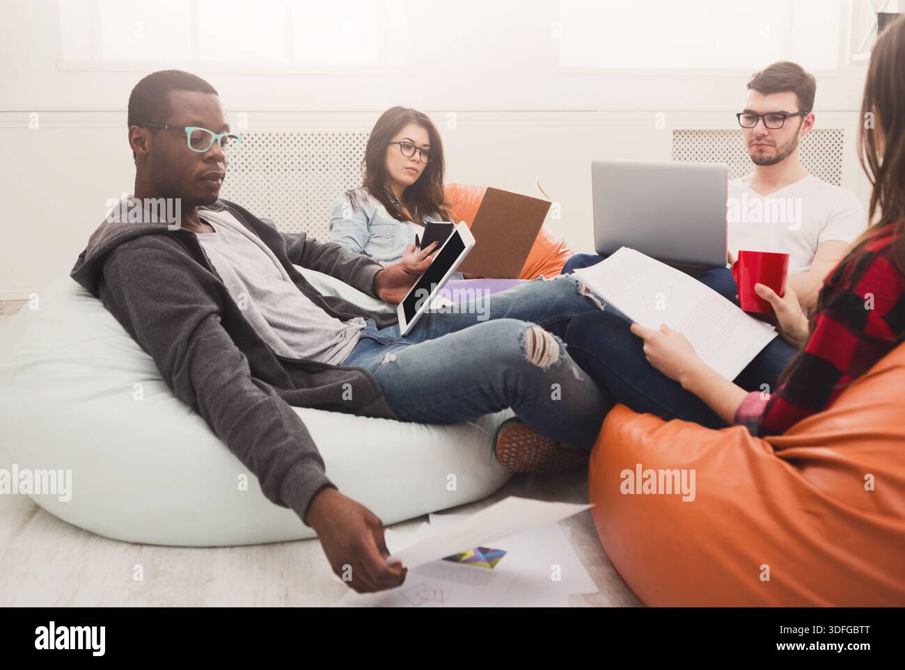 Students share opinions during break Stock Photo