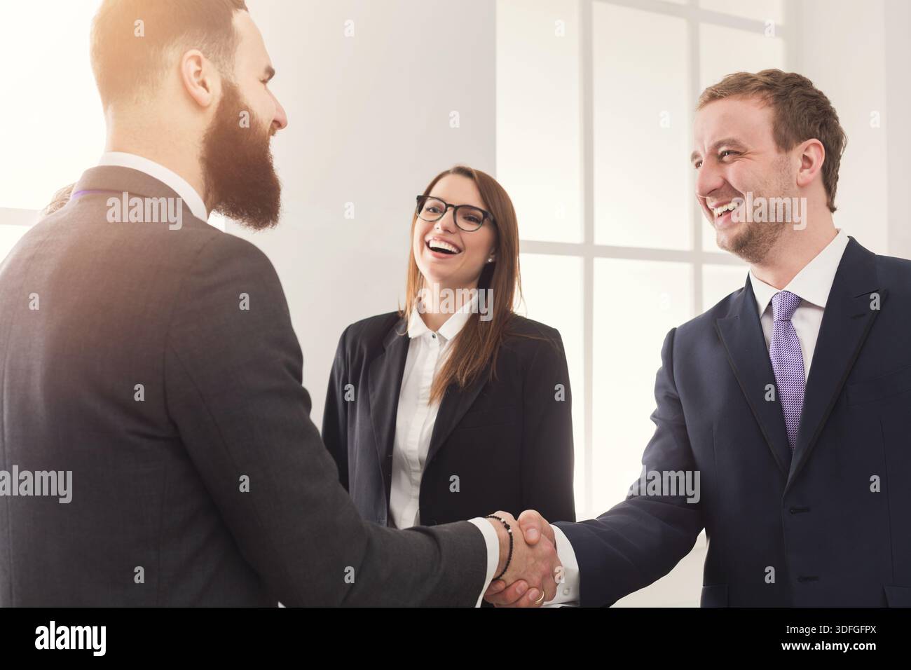 Business handshake at multiethnic office meeting Stock Photo
