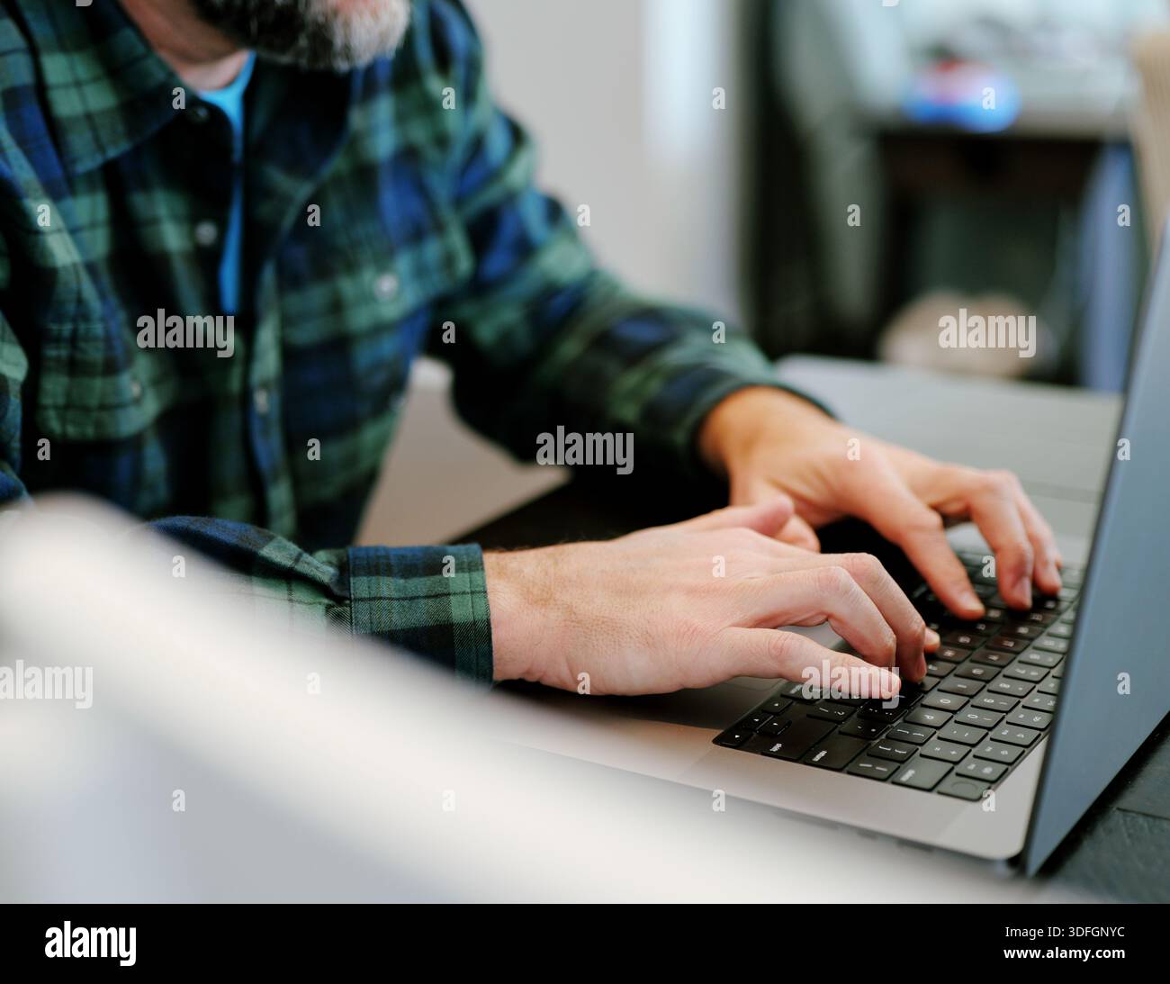 Middle Aged Coder Man Vibe Coding in Artificial Intelligence Infused Integrated Development Environment - Software Engineer Uses AI Based IDE Concept Stock Photo