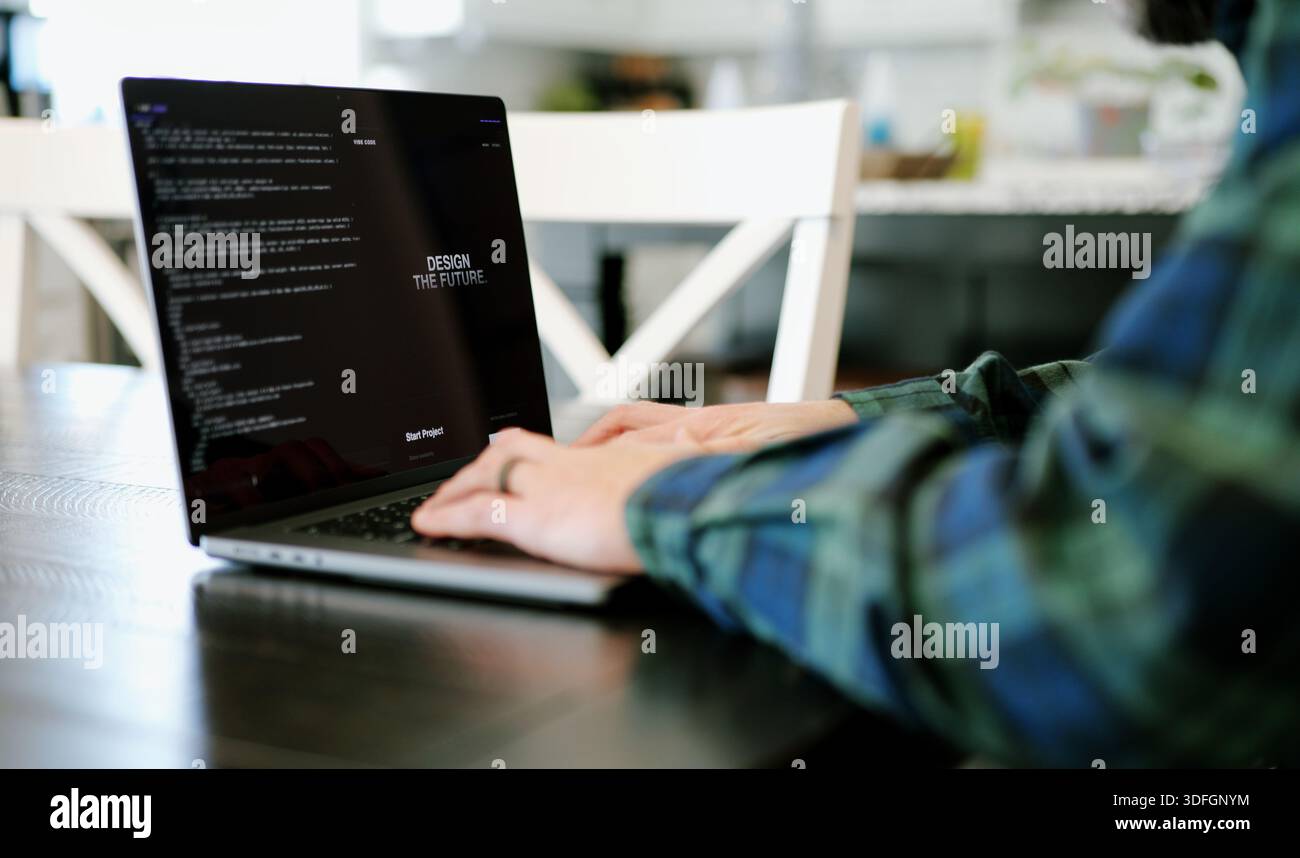 Middle Aged Coder Man Vibe Coding in Artificial Intelligence Infused Integrated Development Environment - Software Engineer Uses AI Based IDE Concept Stock Photo
