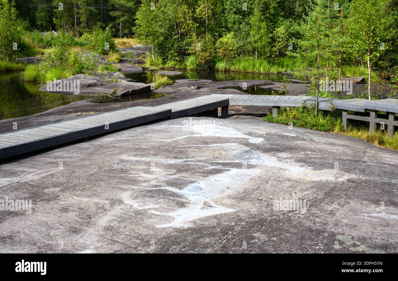 Walk Over Rocks Scenic view of wooden walkway over stones and rocks in ancient art area ...