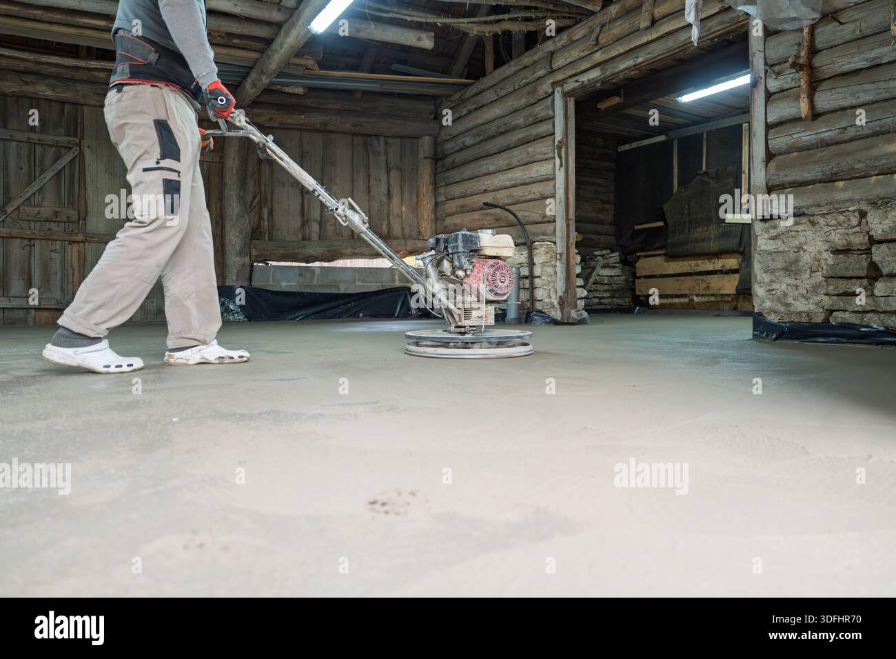 Concrete Polishing Worker Smoothing Surface with Grinding Machine in ... - Improved Methods For Smoothing Textured Concrete With Machines