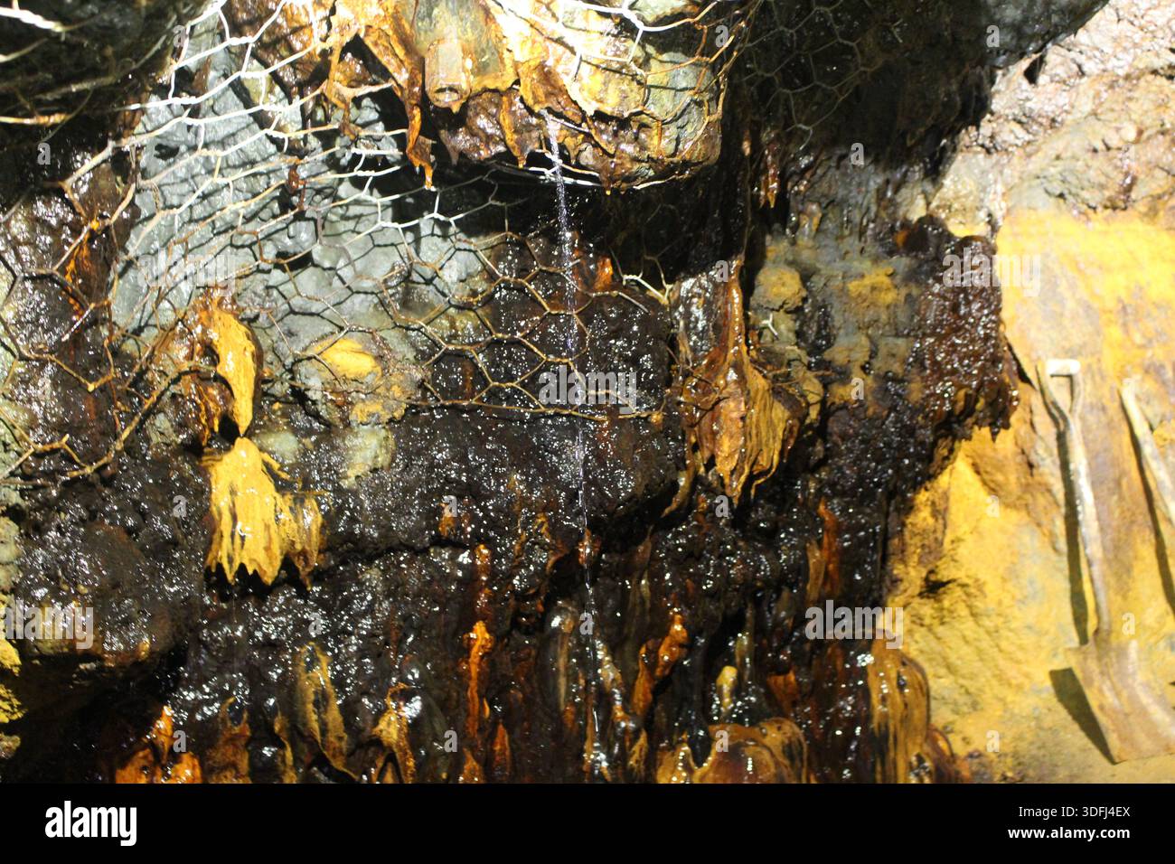 Underground Mine Pattern Iron ore mine interior with oxidized mineral formations and rock ...