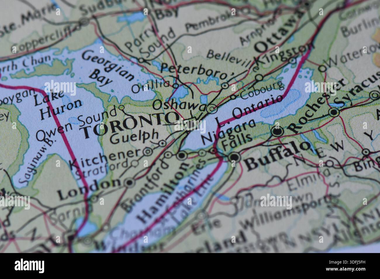 Close-up of a vintage-style map featuring Toronto, Lake Ontario, Niagara Falls, and Buffalo, showing the border region between Canada and the USA. Stock Photo