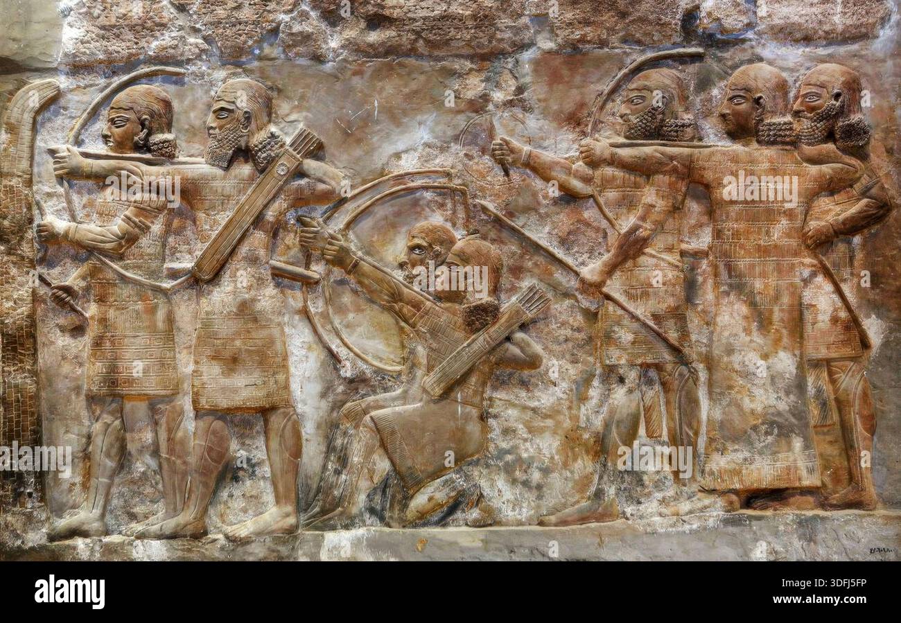 8090. Assyrian Army Archers Conquering a Fortified City, relief from Nimrud dating c. 865 BC. Stock Photo