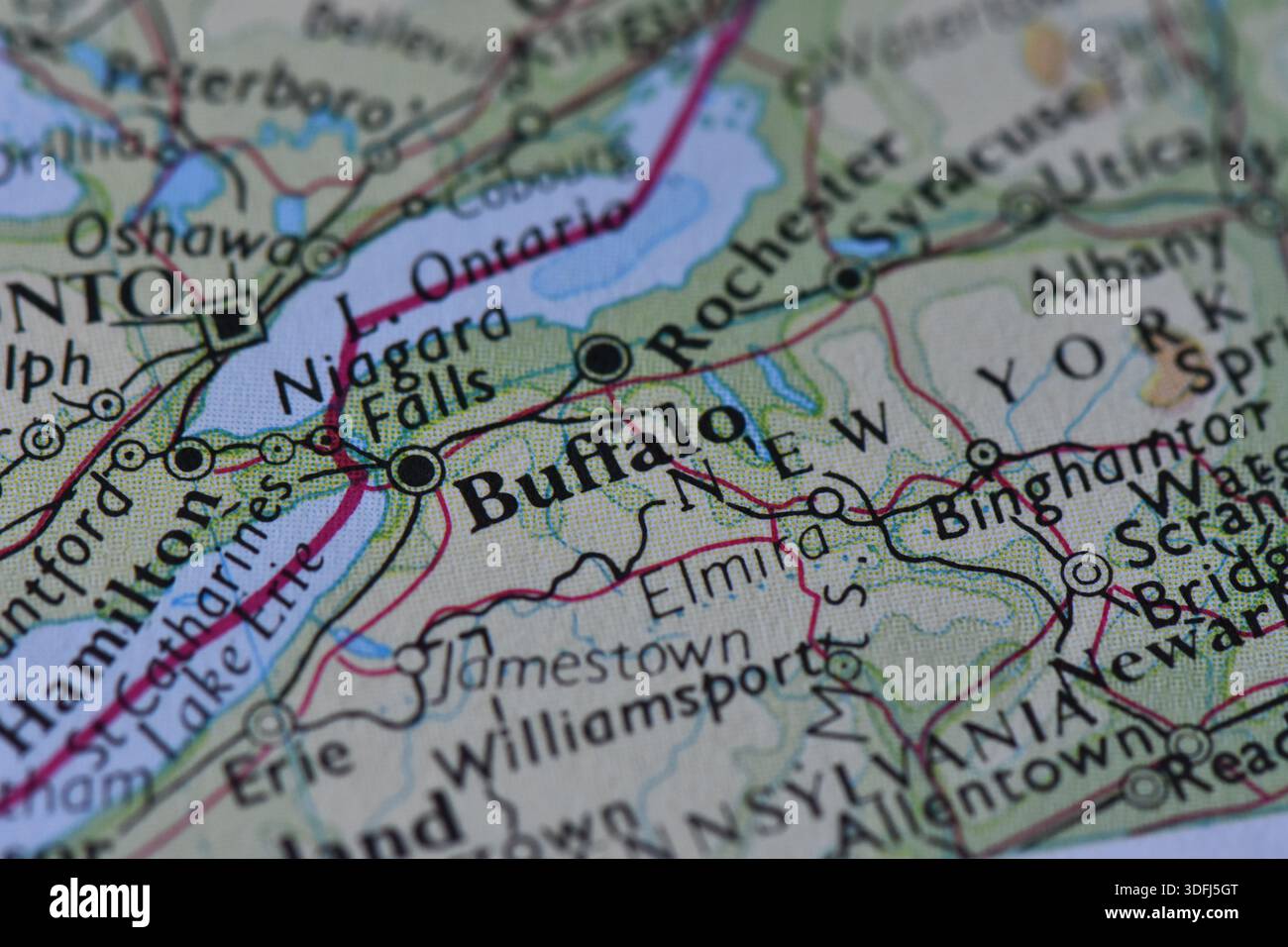 Macro close-up of a geographical map focusing on Buffalo, Niagara Falls, and the border between New York State and Ontario, Canada. Stock Photo