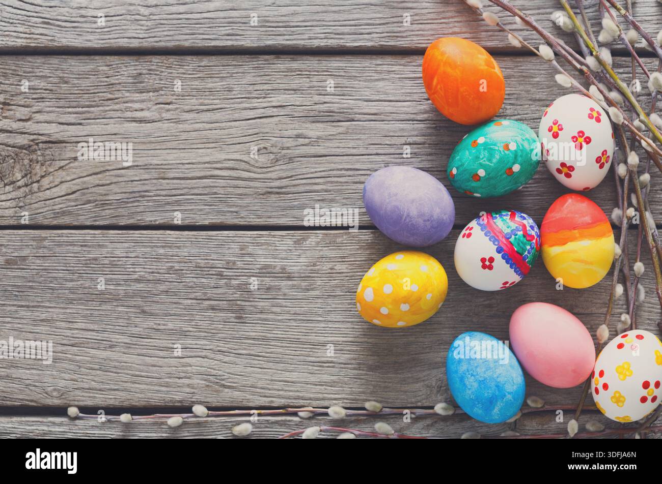 Festive Easter Eggs Arranged on a Rustic Wooden Surface With Delicate Branches Stock Photo