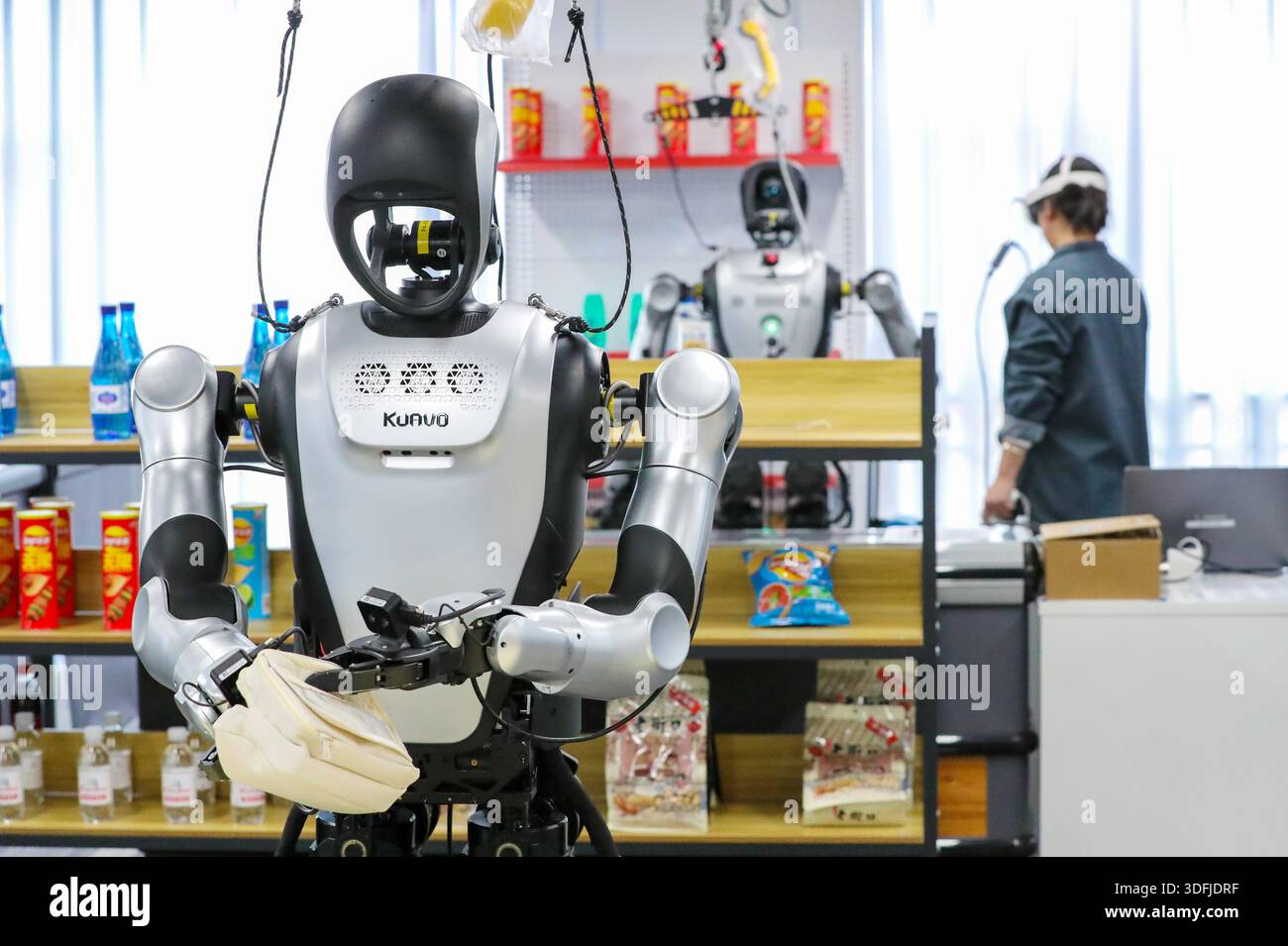 Robots practice grasping objects at a humanoid robot data collection ...