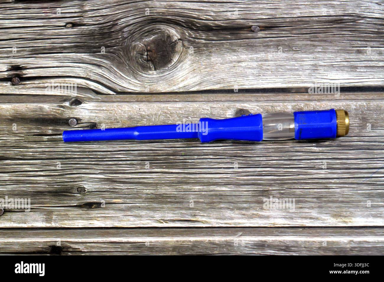 Electroprobe, a voltage tester screwdriver, a standard screwdriver with an internal resistor and neon lamp to safely test for the presence of AC volta Stock Photo