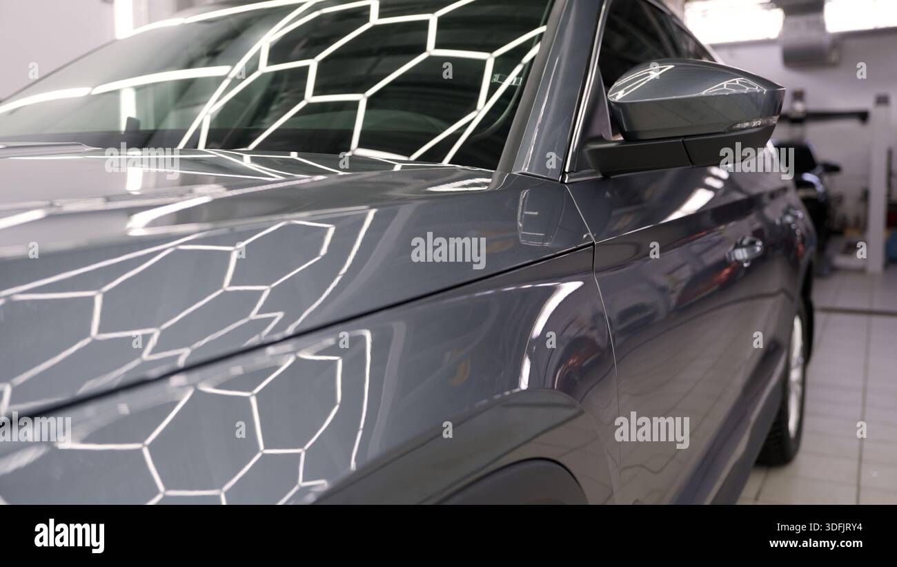 Professional automotive technicians performing detailed body repair on