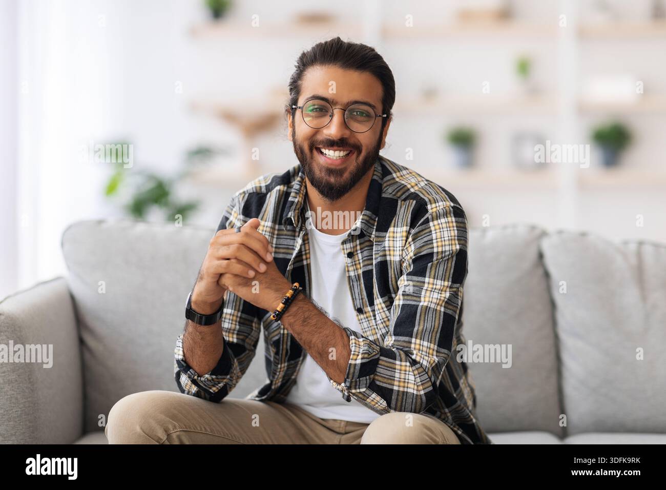 Handsome middle-eastern millennial man posing at home Stock Photo