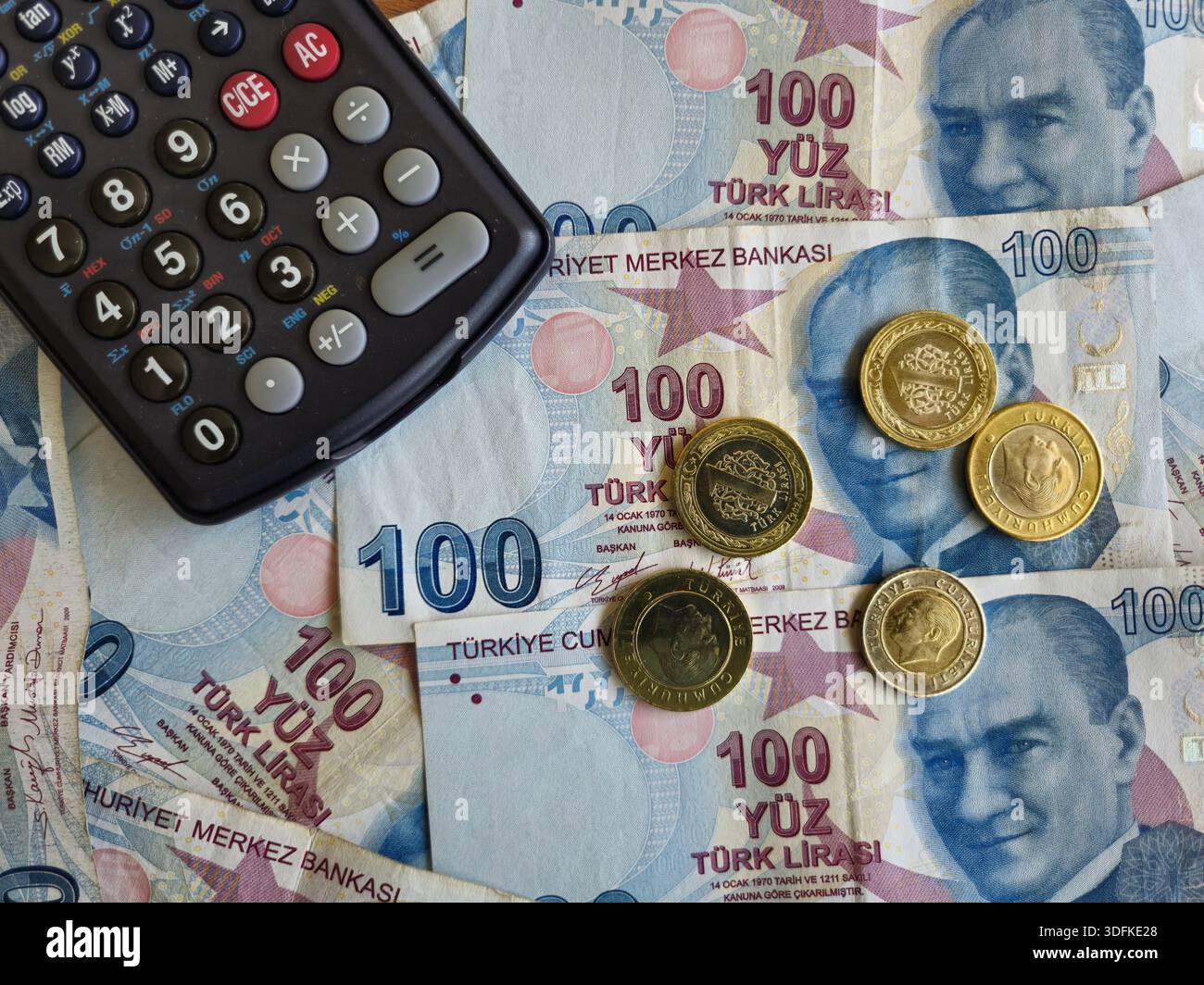 Business and Financial concept with 100 turkish lira banknotes, calculator and coins - Smartphone Captured Stock Image