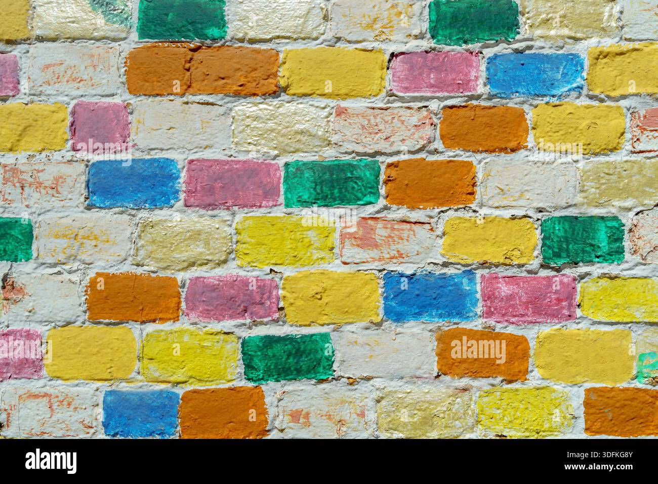 Wall made of multi-colored bricks. Abstract design background Stock ...