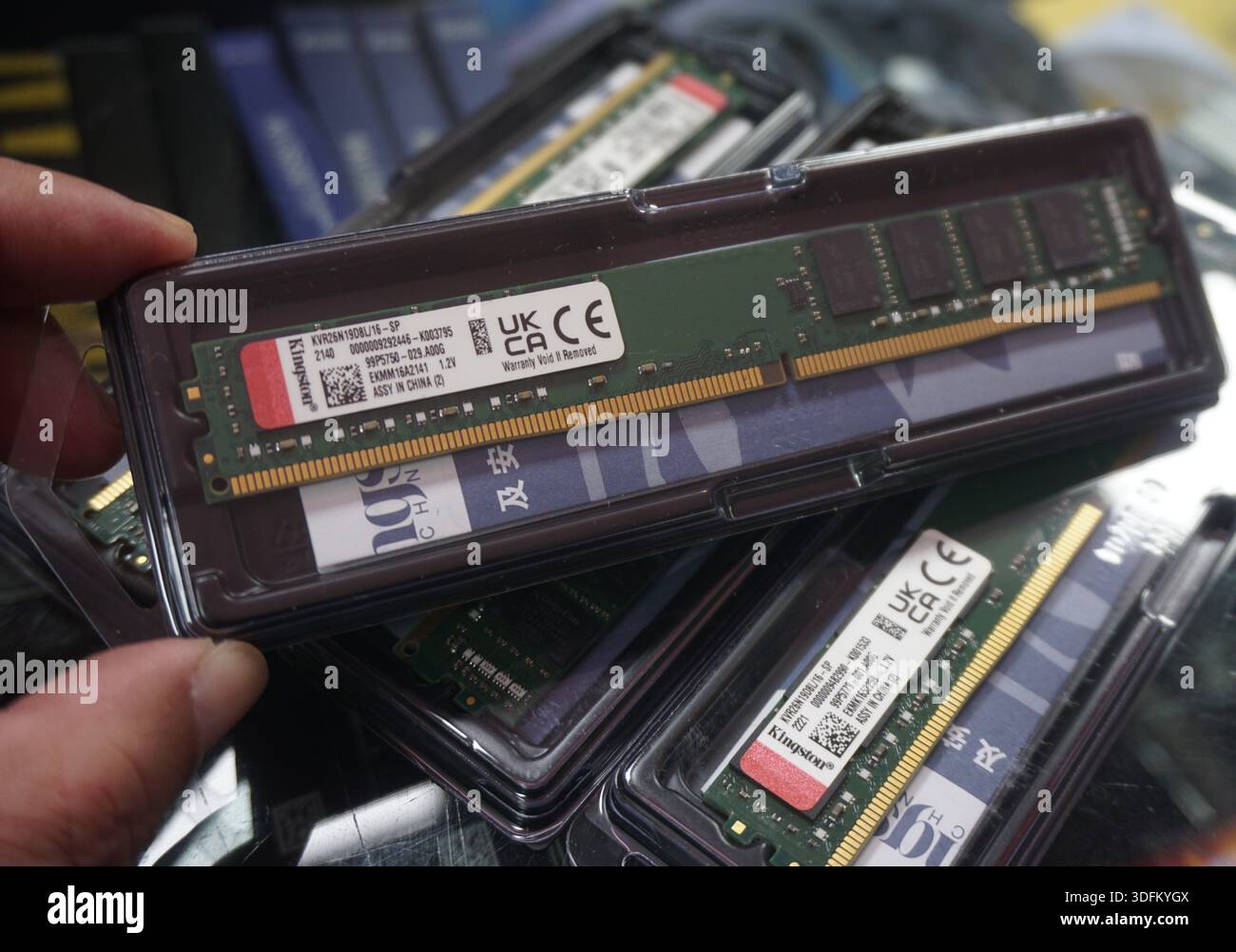 A vendor displays RAM sticks at an electronics market in Hangzhou, in ...