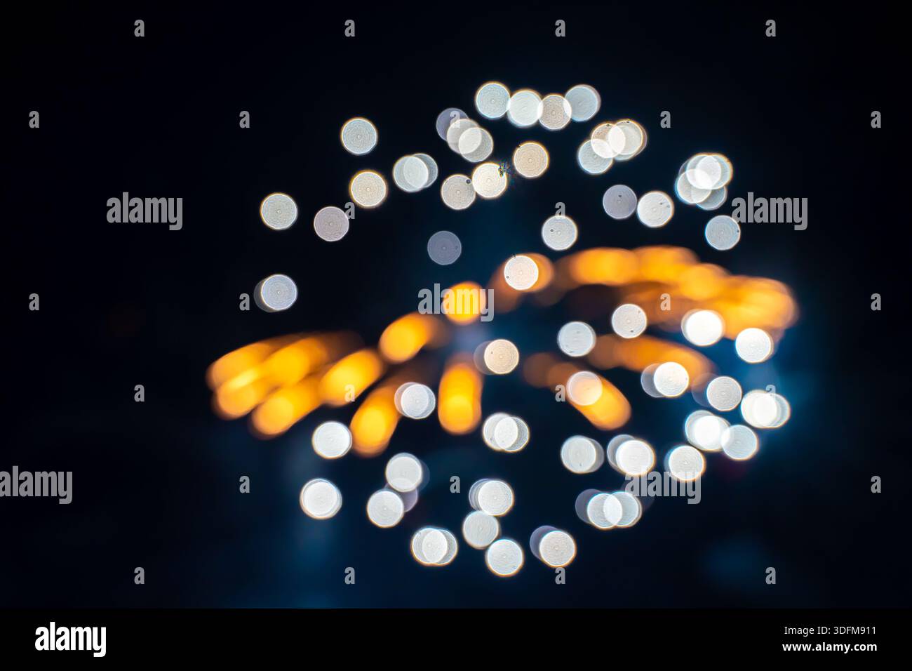 fireworks exploding in the night sky, presented with a bokeh effect Stock Photo
