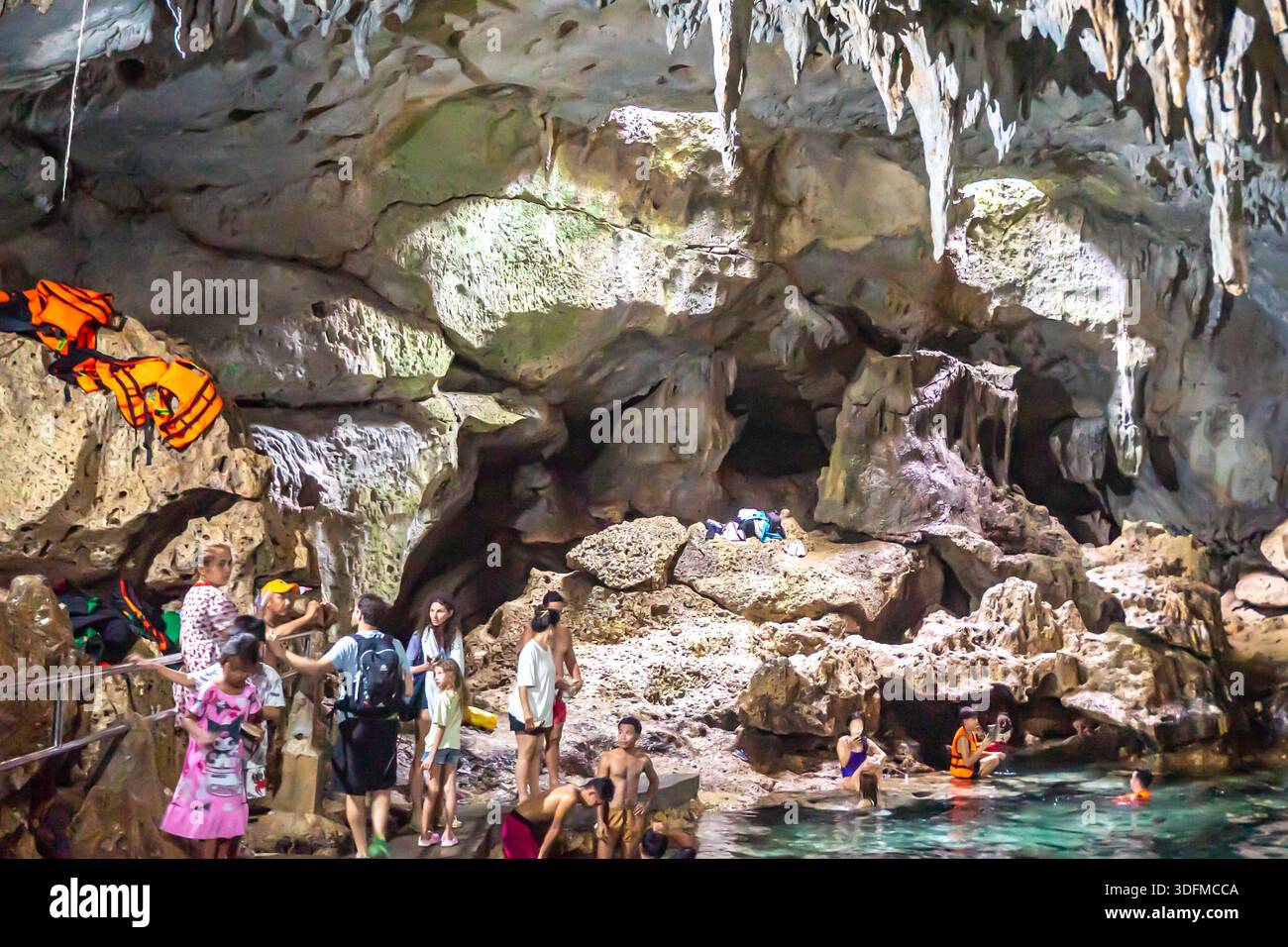 Tourists inside Hinagdanan Cave and Bath Resort in Bohol, Philippines. Stock Photo