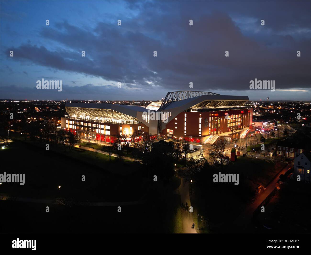 Aerial view of Anfield stadium, home of Liverpool FC, at dusk. Glowing ...