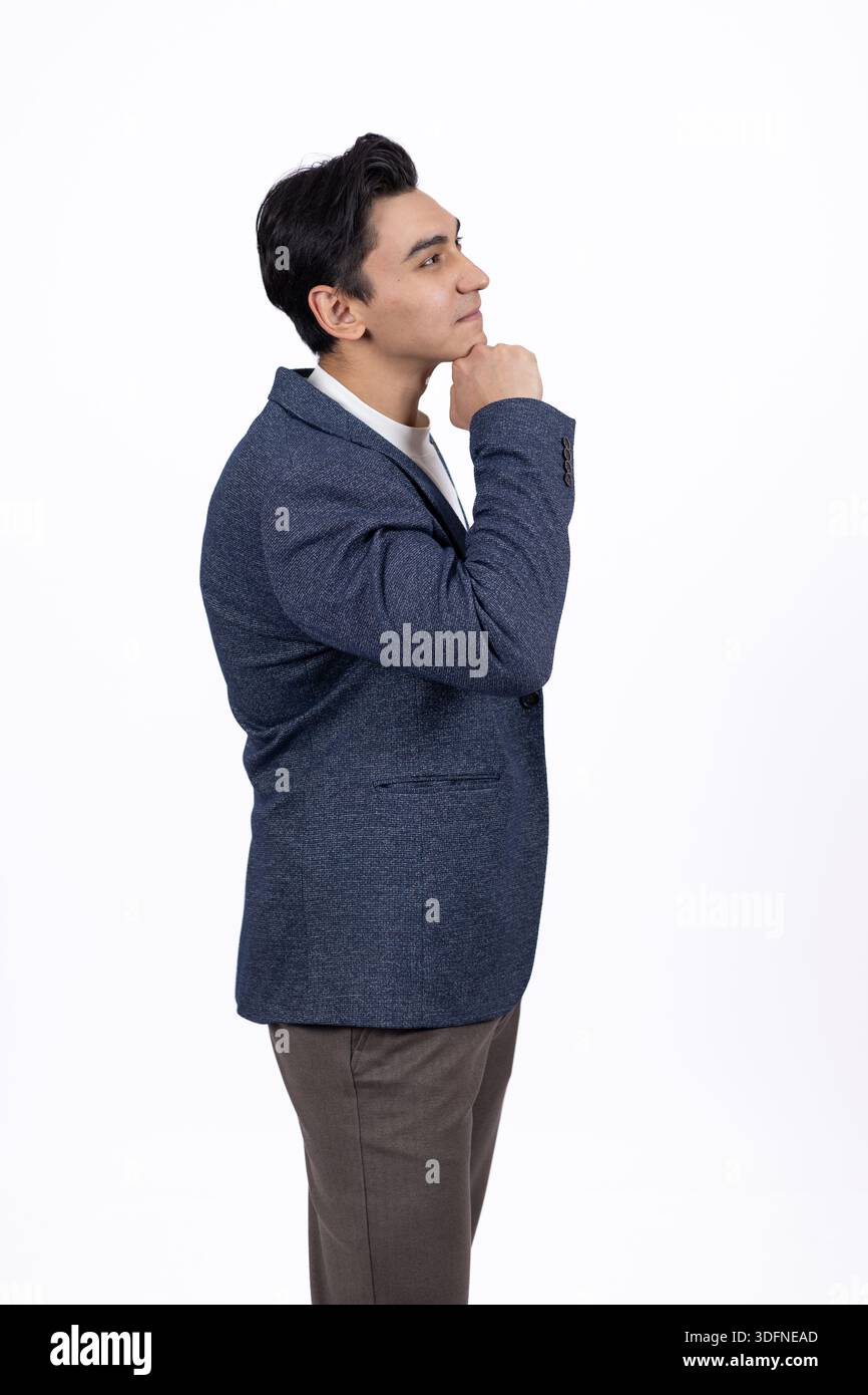 Thoughtful man touching his chin Stock Photo
