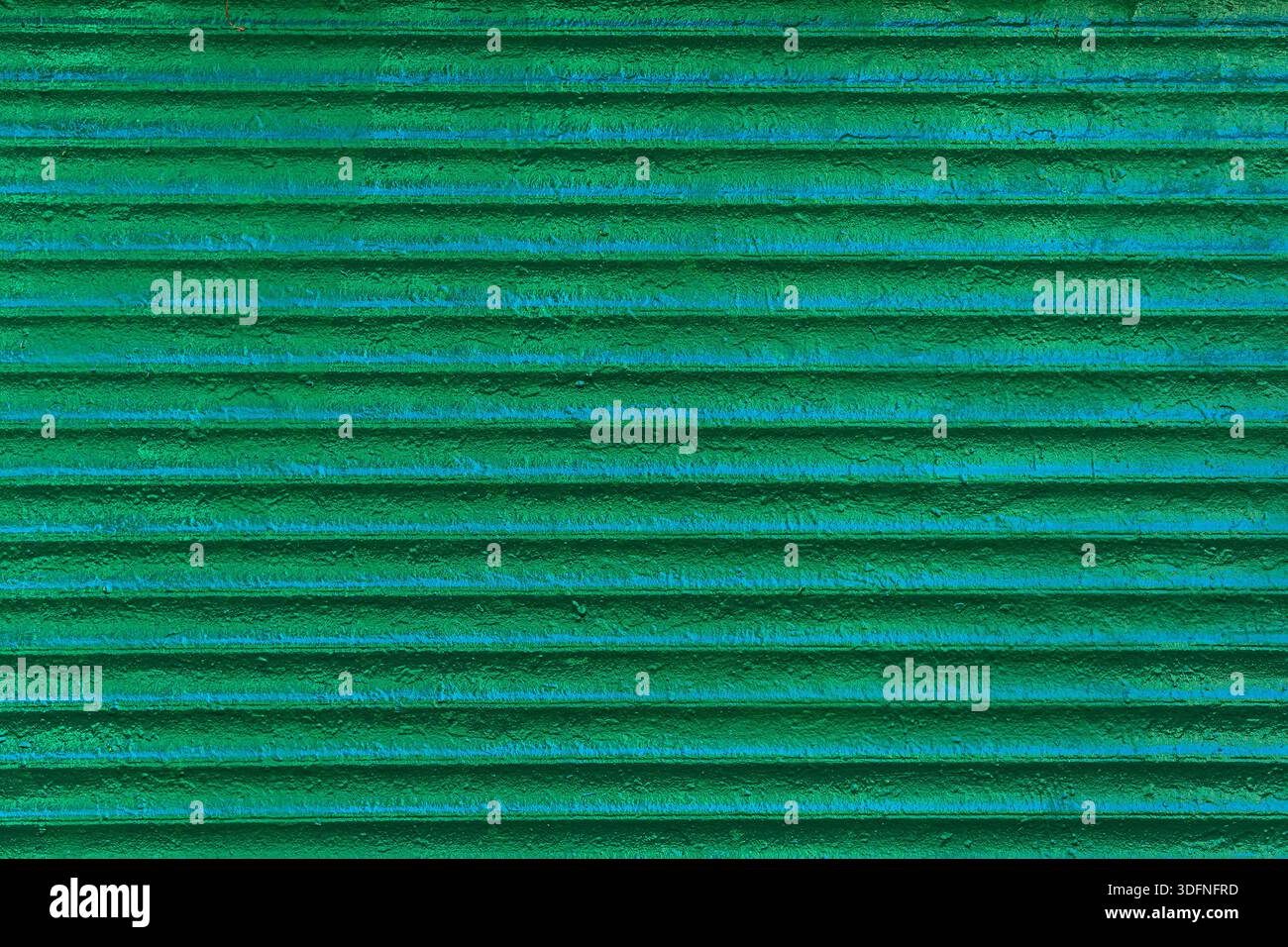 Striped surface covered with green paint. Abstract geometric pattern. Stock Photo