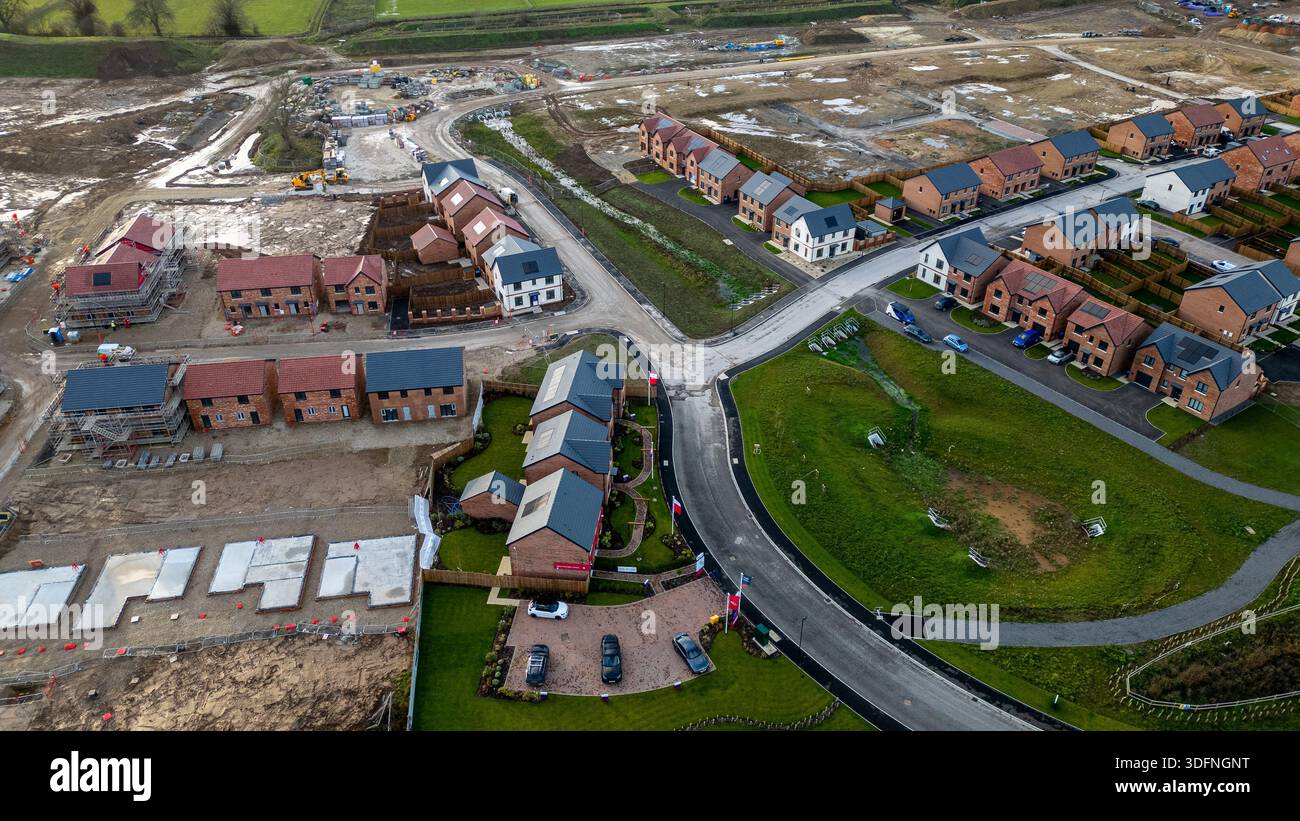 Aerial view of a housing development under construction, featuring ...