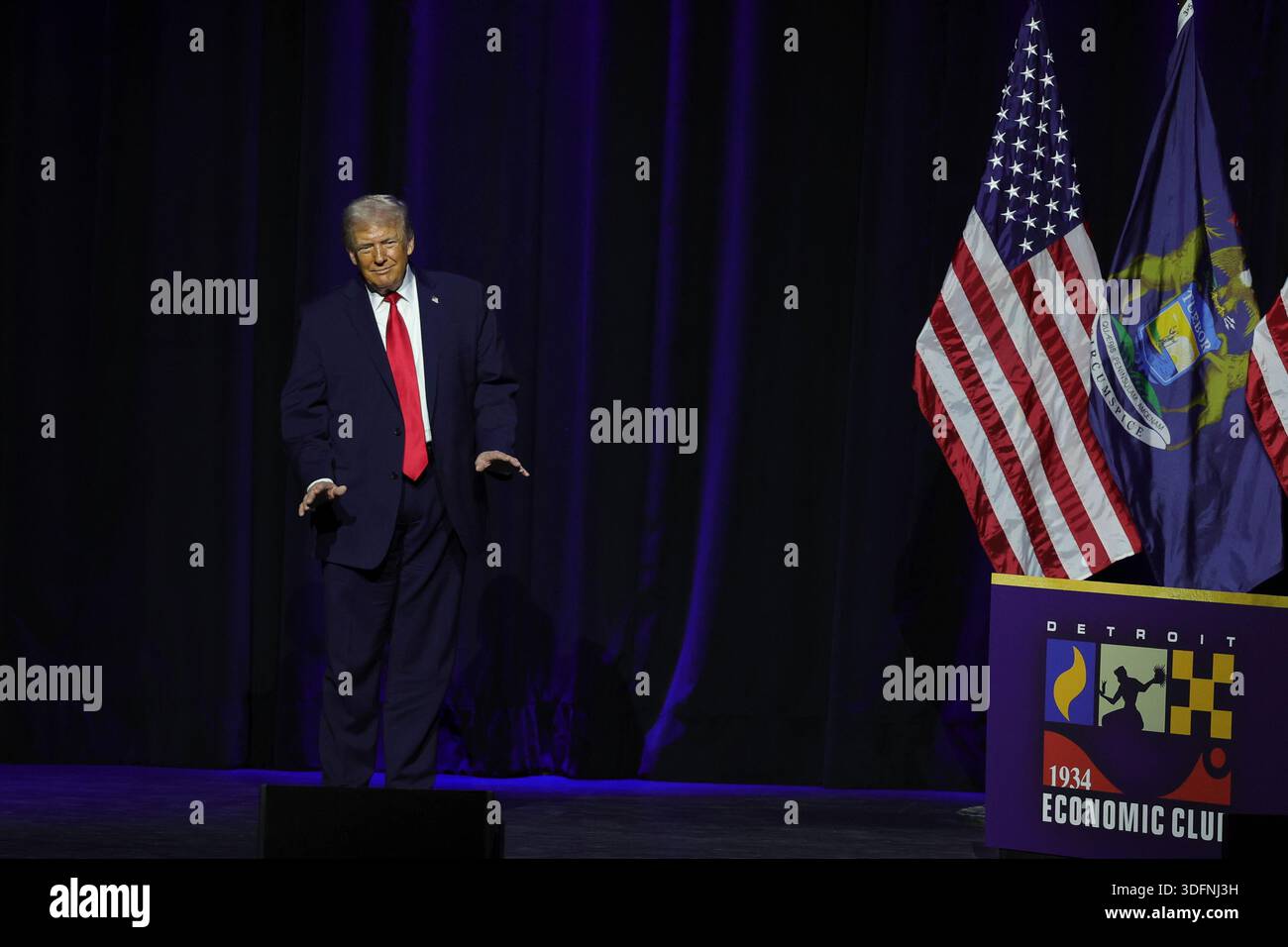 President Donald Trump walks on stage to speak at the Detroit Economic ...