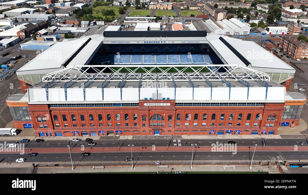 Aerial view of Ibrox Stadium, the home ground of Rangers FC, showing the historic red-brick main stand and surrounding urban area in Glasgow. Daytime Stock Photo