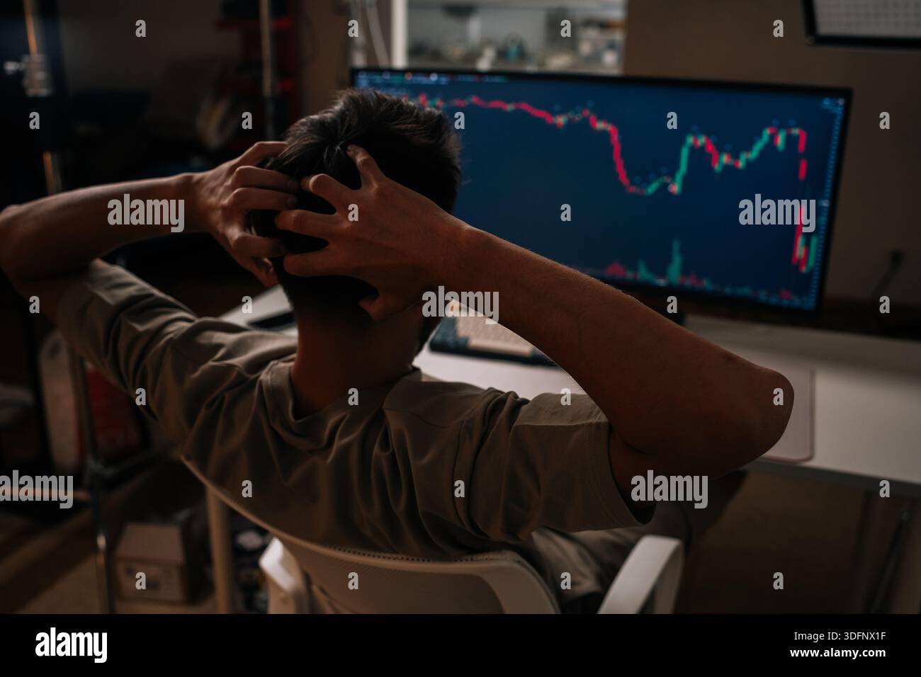 Worried trader in home office stares at red stock and crypto chart on  desktop computer, showing sharp bearish downturn and causing stress,  anxiety and Stock Photo - Alamy